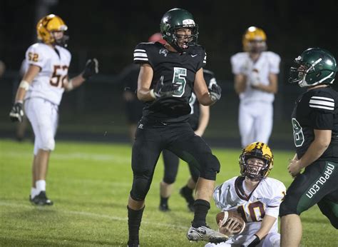 Napoleon football holds off late Manchester rally for .